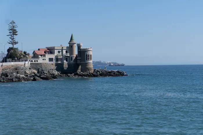 Castillo Wulff, a castle-like building with turrets perched on rocky coastline overlooking the Pacific Ocean in Viña del Mar, Chile