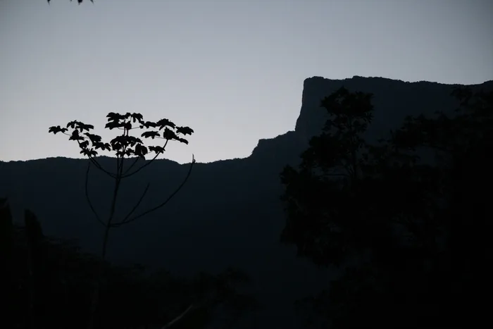 Silhouette of the mountain ridge and forest vegetation viewed from Sítio Folha Seca at dusk